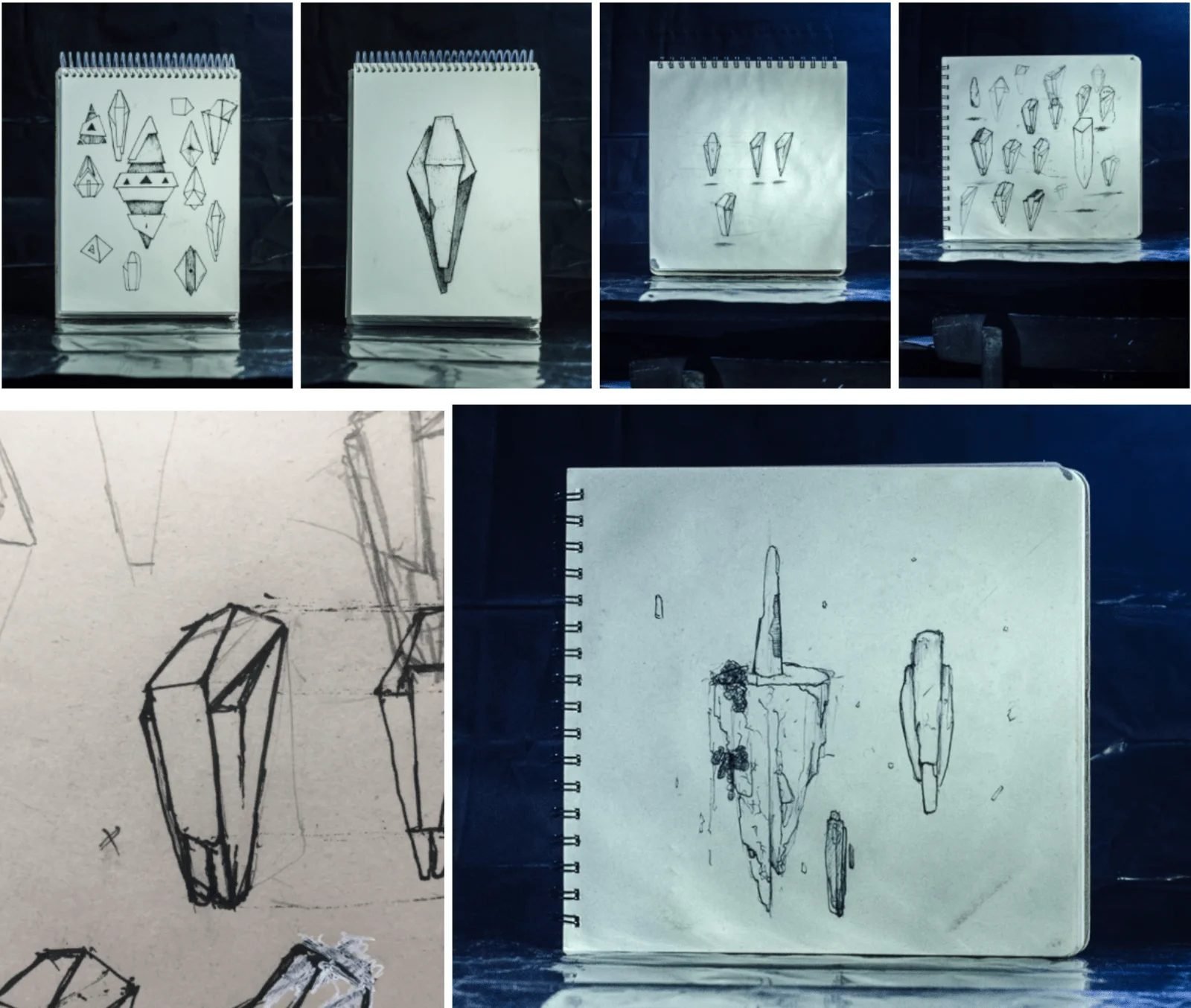 Bocetos a lápiz de formas cristalinas en cuadernos, fotografiados sobre fondo azul oscuro